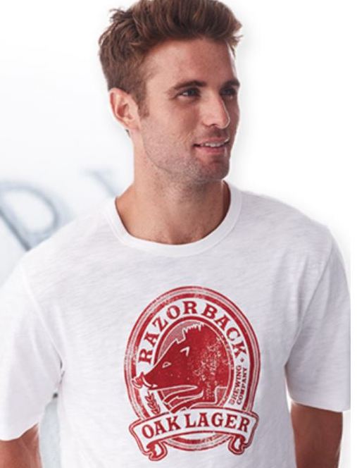 Transfer logo on a shirt with a guy smiling