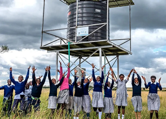 Happy kids with a water reservoir